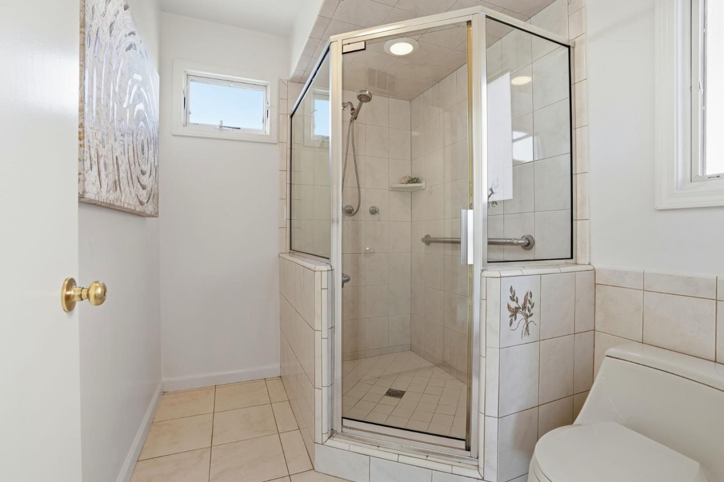 1190 Flying Fish Street Foster City, CA 94404 - Photo 28 of 45 a bathroom with a shower and toilet