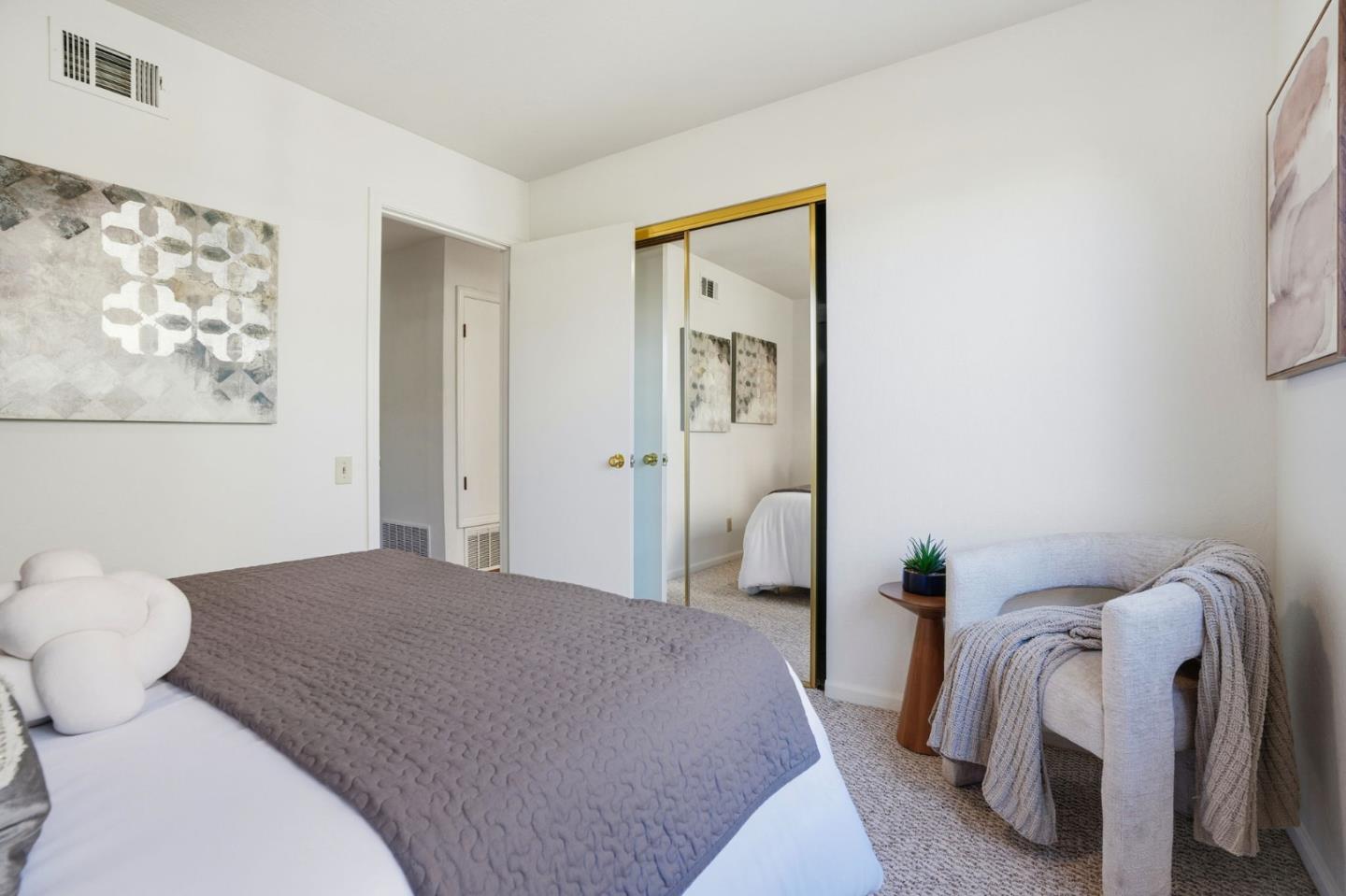 1190 Flying Fish Street Foster City, CA 94404 - Photo 32 of 45 a bedroom with a bed and a painting on the wall