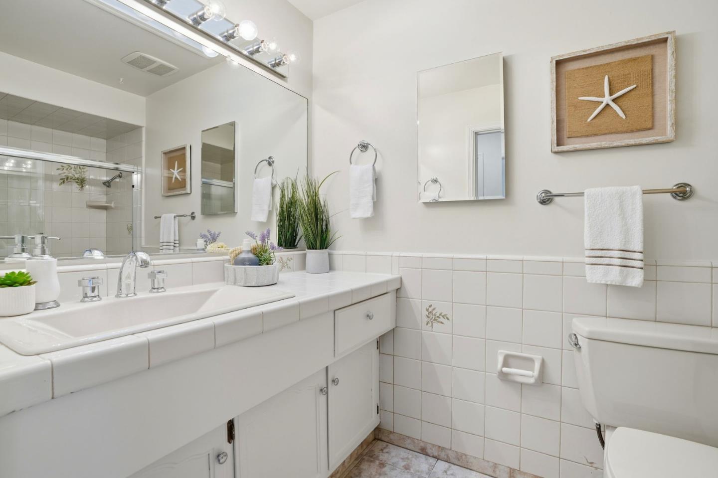 1190 Flying Fish Street Foster City, CA 94404 - Photo 35 of 45 a bathroom with a double vanity sink mirror and toilet