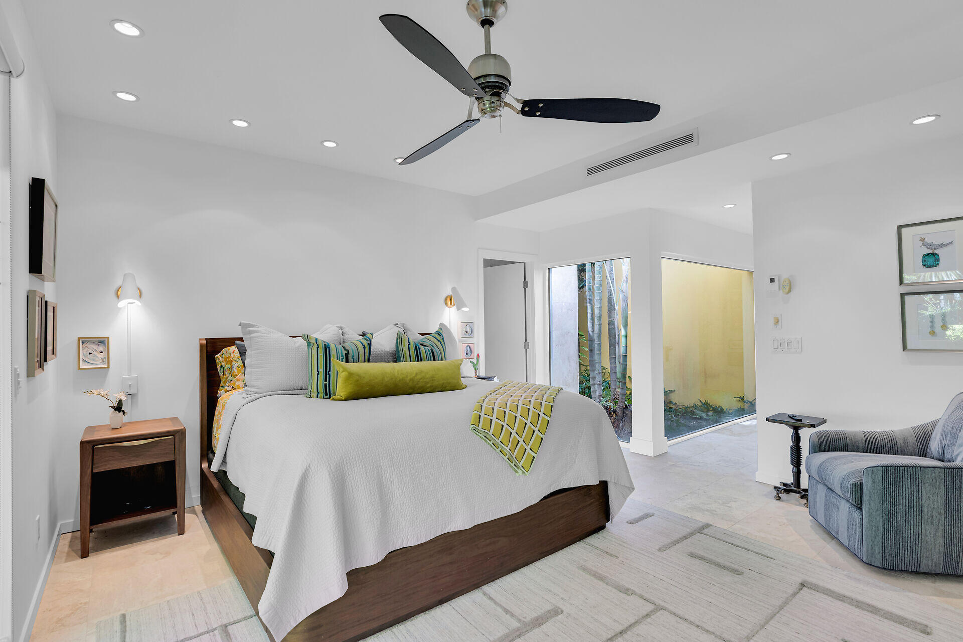 1501 Georgia Street Key West, FL 33040 - Photo 11 of 50 a bedroom with a bed a couch and a chandelier