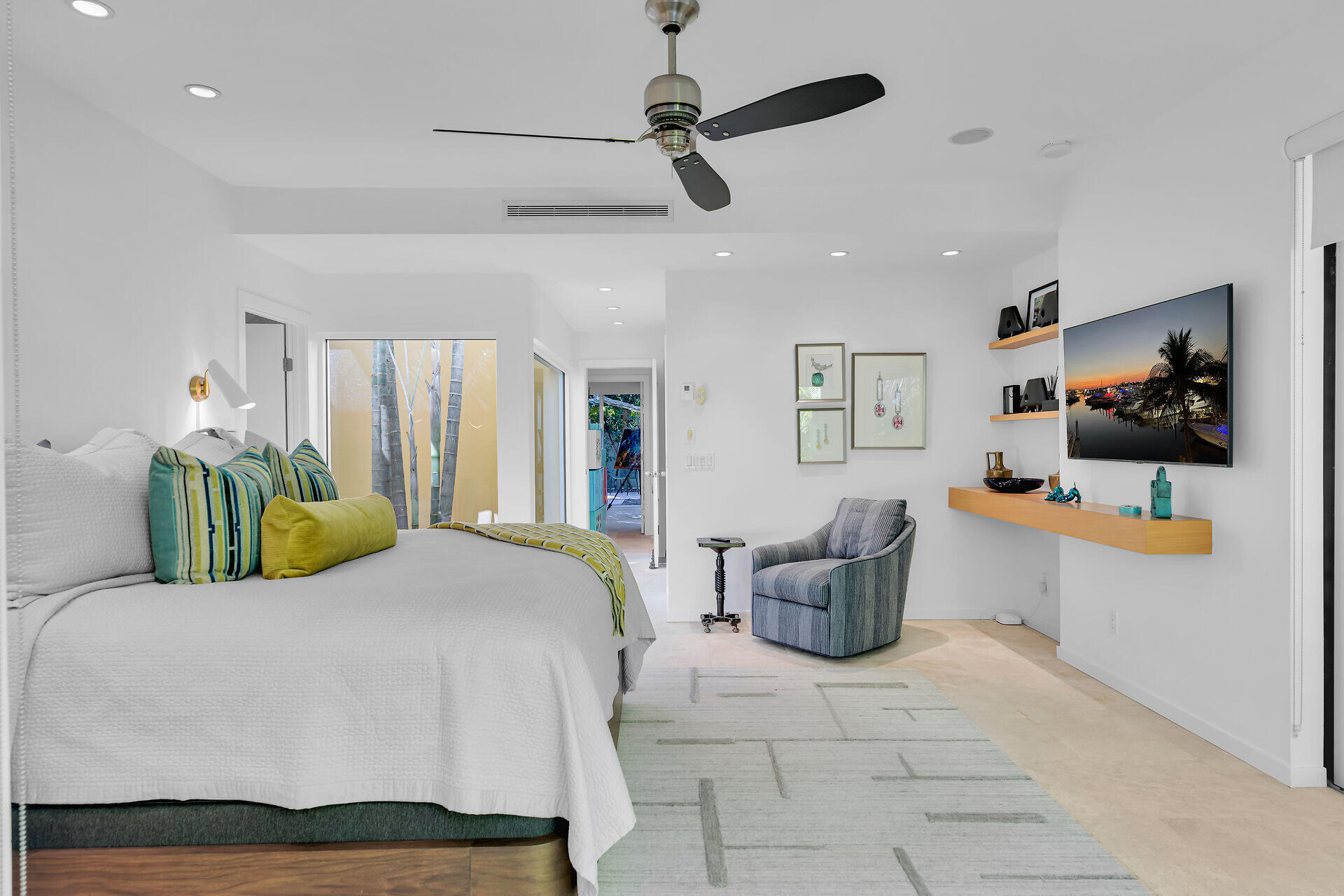 1501 Georgia Street Key West, FL 33040 - Photo 12 of 50 a bedroom with a bed mirror and couch