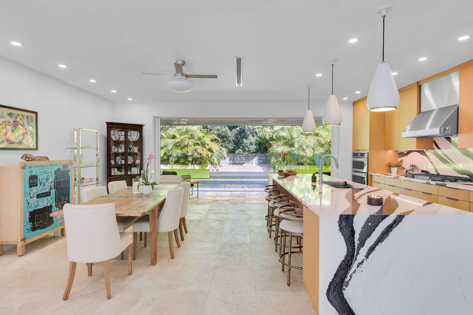 1501 Georgia Street Key West, FL 33040 - Photo 12 of 50 a view of a dining room with furniture a chandelier and wooden floor