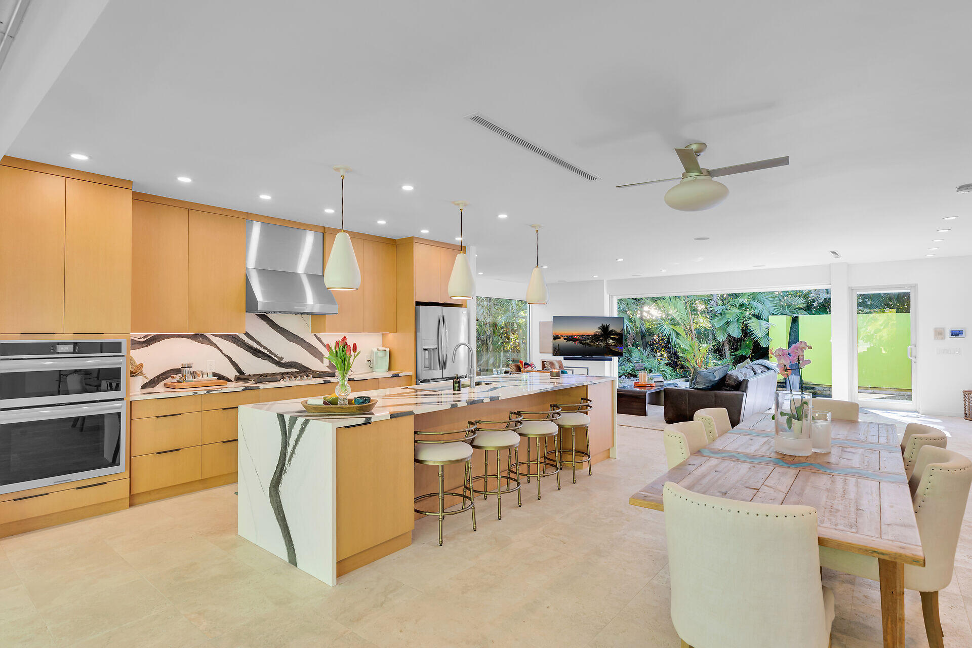 1501 Georgia Street Key West, FL 33040 - Photo 15 of 50 a kitchen with stainless steel appliances kitchen island granite countertop a sink and a refrigerator