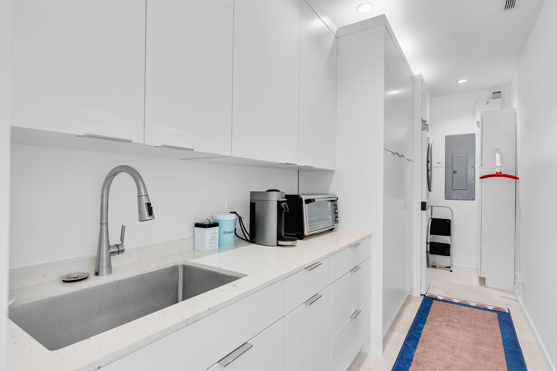1501 Georgia Street Key West, FL 33040 - Photo 22 of 50 a kitchen with a refrigerator sink and white cabinets
