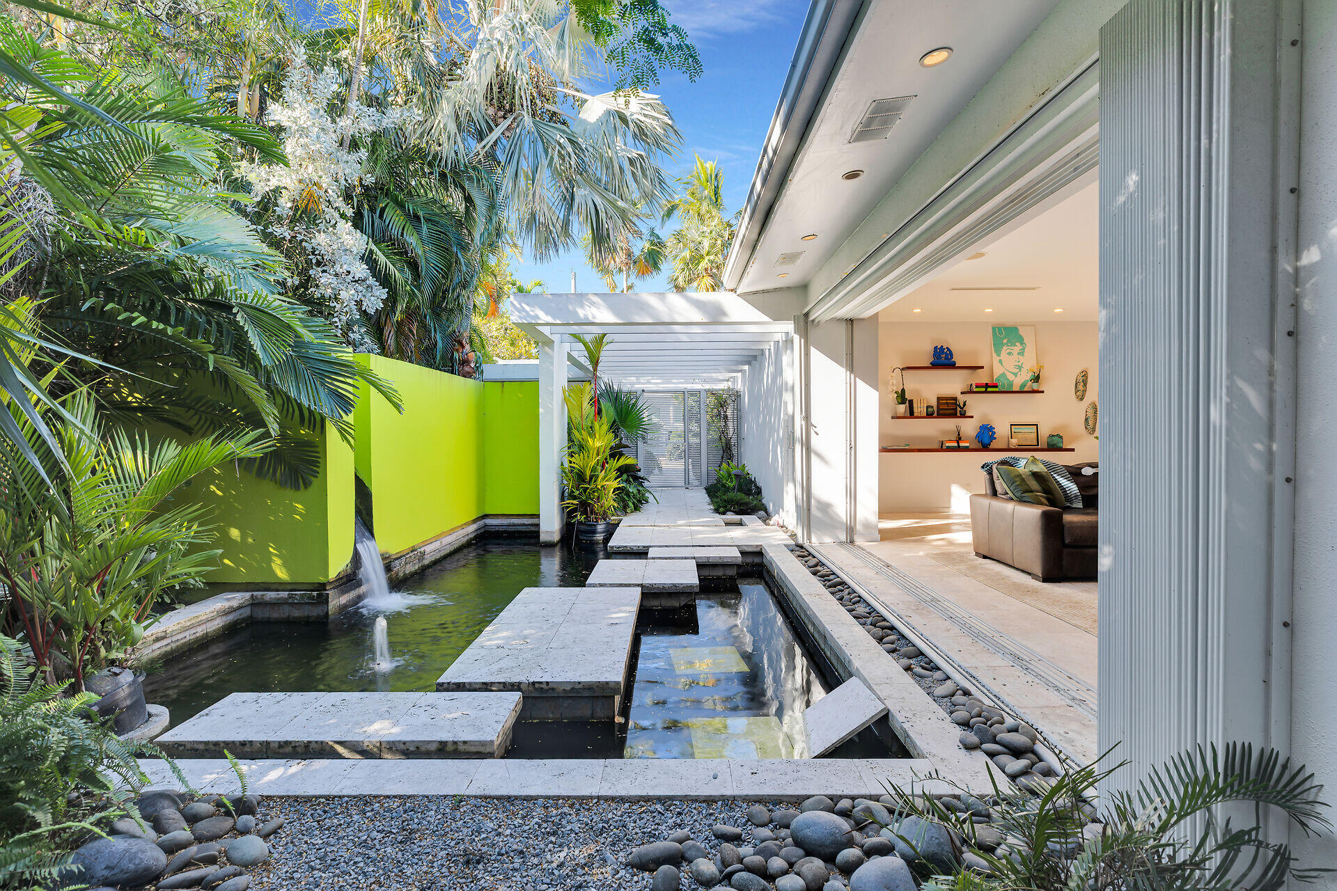 1501 Georgia Street Key West, FL 33040 - Photo 3 of 50 a view of a patio with table and chairs potted plants and large tree