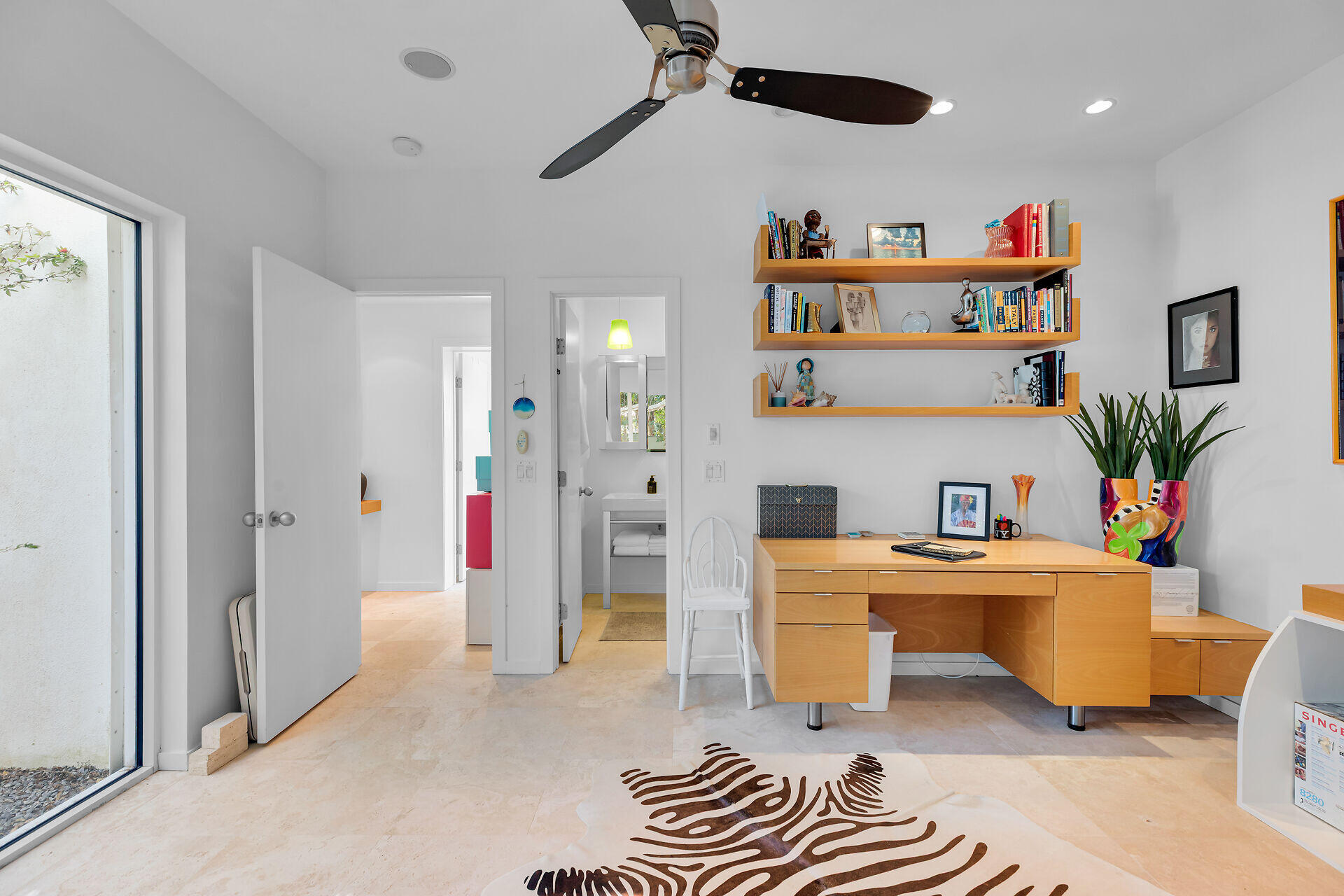 1501 Georgia Street Key West, FL 33040 - Photo 32 of 50 a living room with furniture and a book shelf