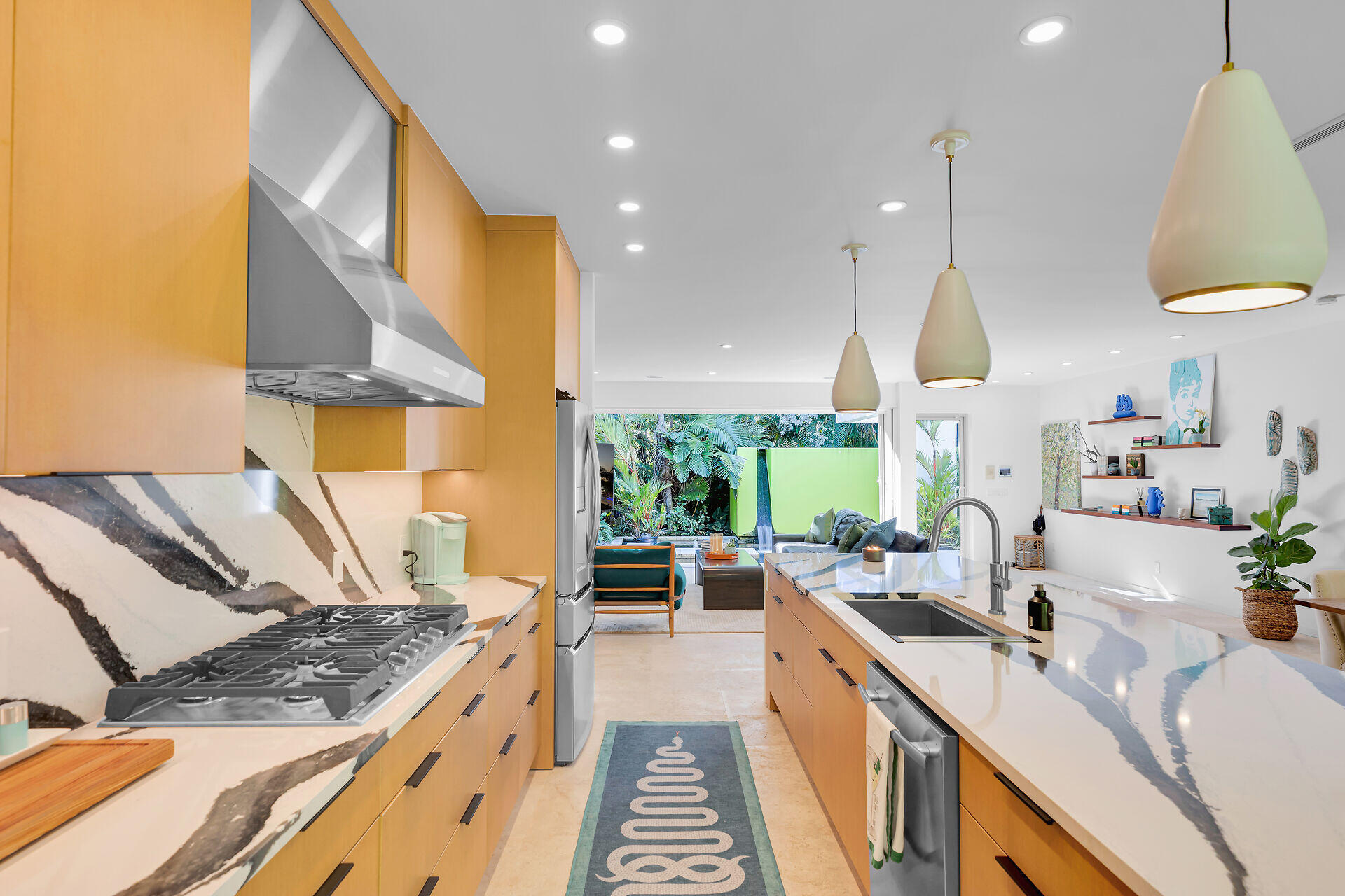1501 Georgia Street Key West, FL 33040 - Photo 47 of 50 a kitchen with stainless steel appliances granite countertop a sink a stove and a wooden floors