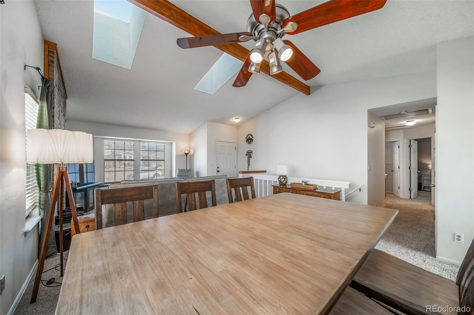 9240 Stargrass Circle Highlands Ranch, CO 80126 - Photo 12 of 46 a bedroom with a large bed and a chandelier