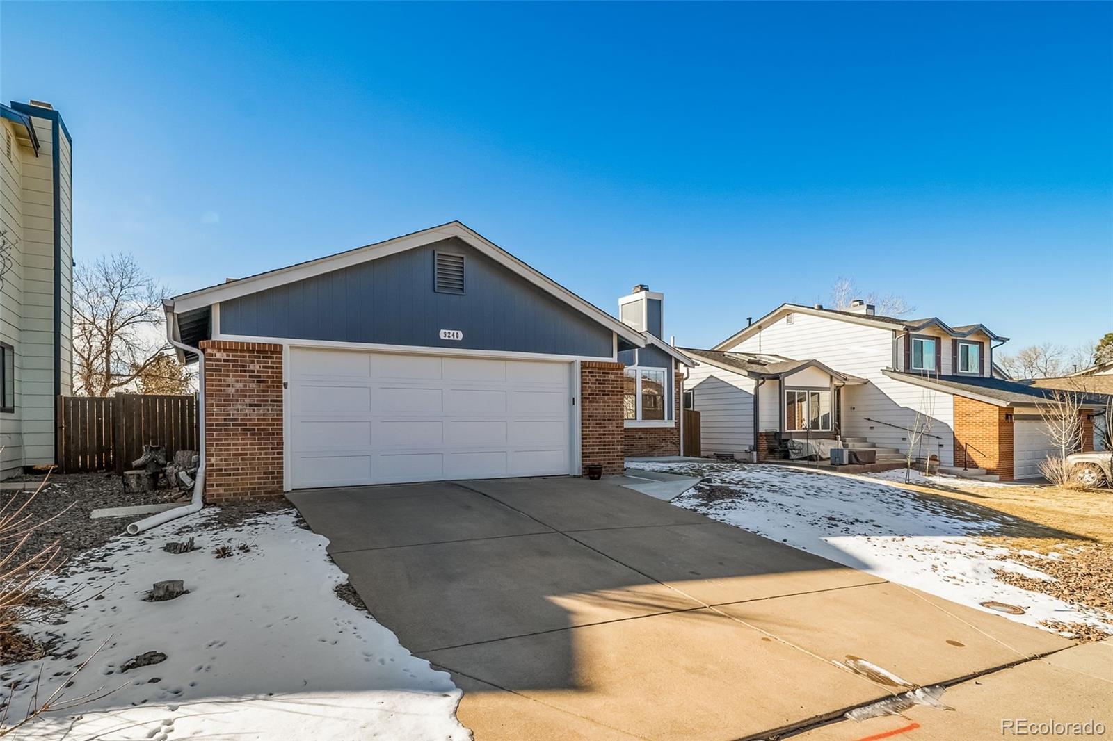 9240 Stargrass Circle Highlands Ranch, CO 80126 - Photo 2 of 46 a front view of a house with a yard