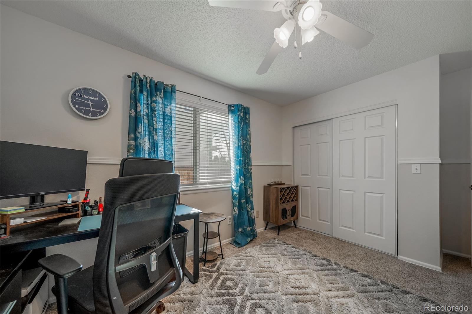 9240 Stargrass Circle Highlands Ranch, CO 80126 - Photo 31 of 46 a view of a workspace with furniture and a window
