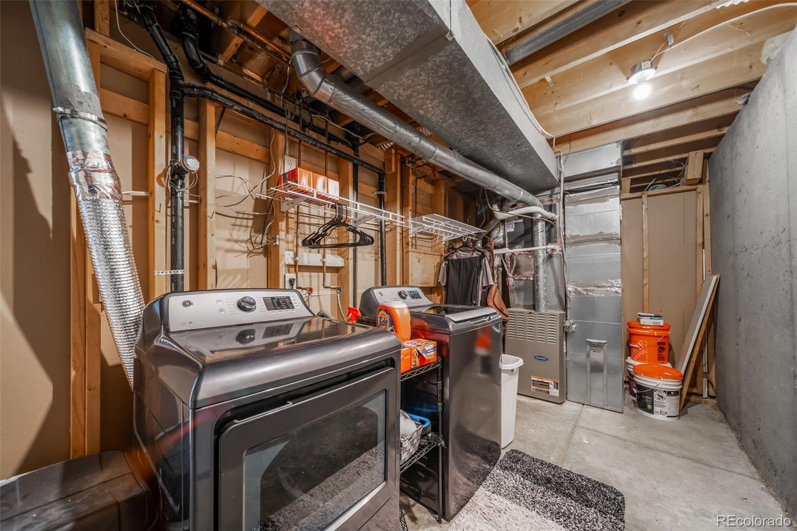 9240 Stargrass Circle Highlands Ranch, CO 80126 - Photo 41 of 46 a utility room with dryer and washer