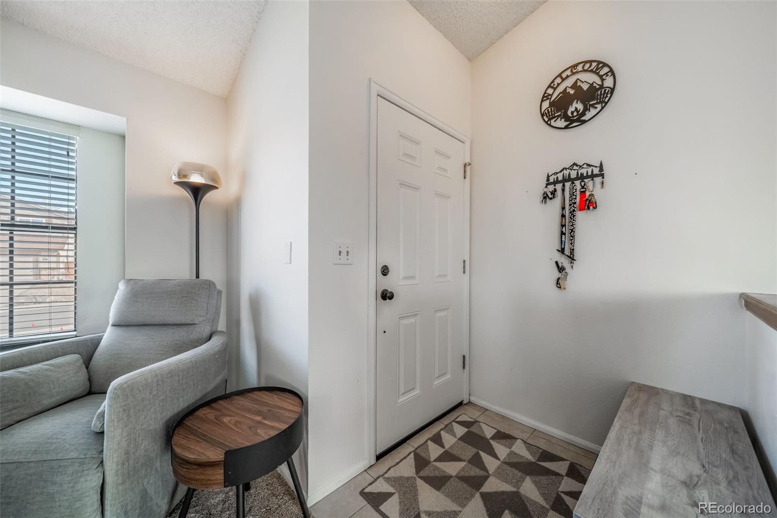 9240 Stargrass Circle Highlands Ranch, CO 80126 - Photo 5 of 46 a bedroom with a bed and a couch