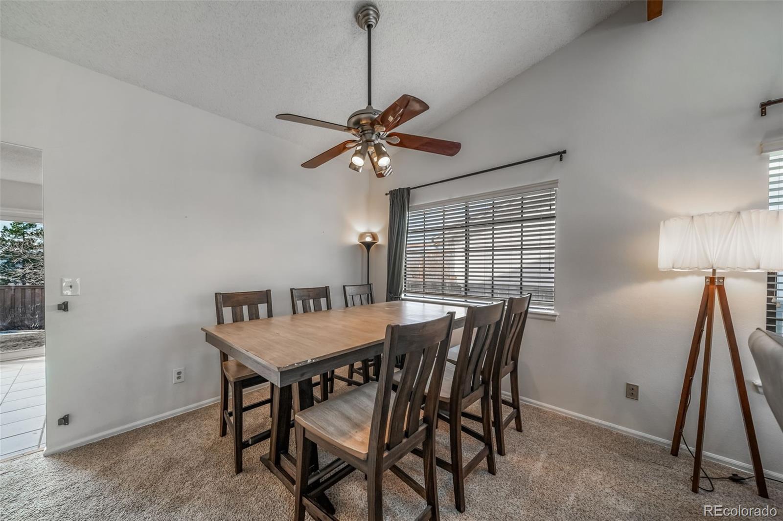 9240 Stargrass Circle Highlands Ranch, CO 80126 - Photo 10 of 46 a view of a dining room with furniture window and wooden floor
