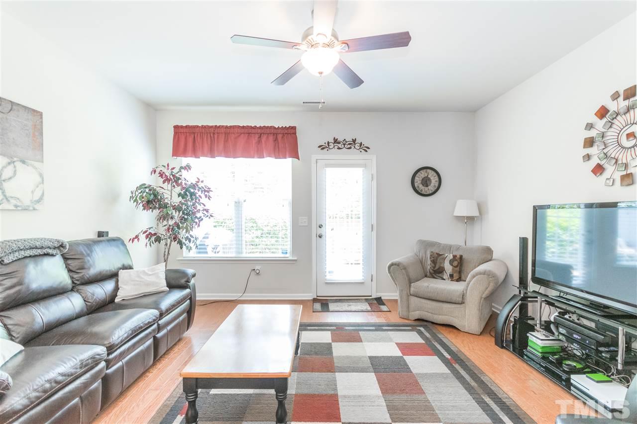 2960 Berkeley Springs Place Raleigh, NC 27616 - Photo 4 of 14 a living room with furniture and a large window