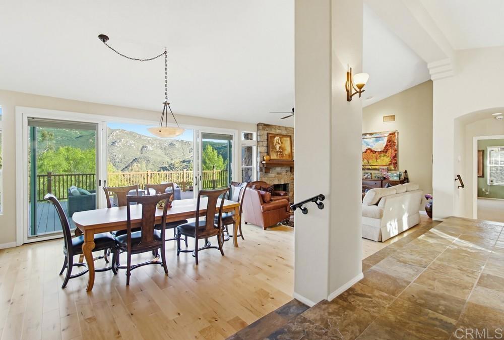3930 Via Palo Verde Lago Alpine, CA 91901 - Photo 19 of 75 a view of a dining room and livingroom with furniture wooden floor a chandelier