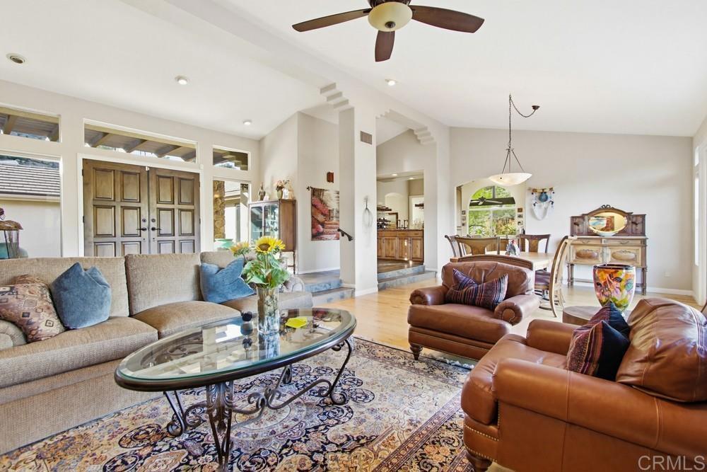 3930 Via Palo Verde Lago Alpine, CA 91901 - Photo 20 of 75 a living room with furniture kitchen view and a chandelier