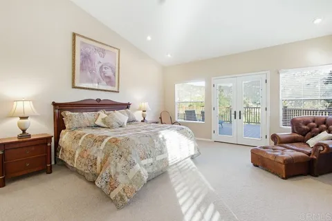 a view of a porch with furniture and a yard