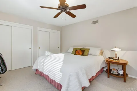 a view of a house with a swimming pool and a yard