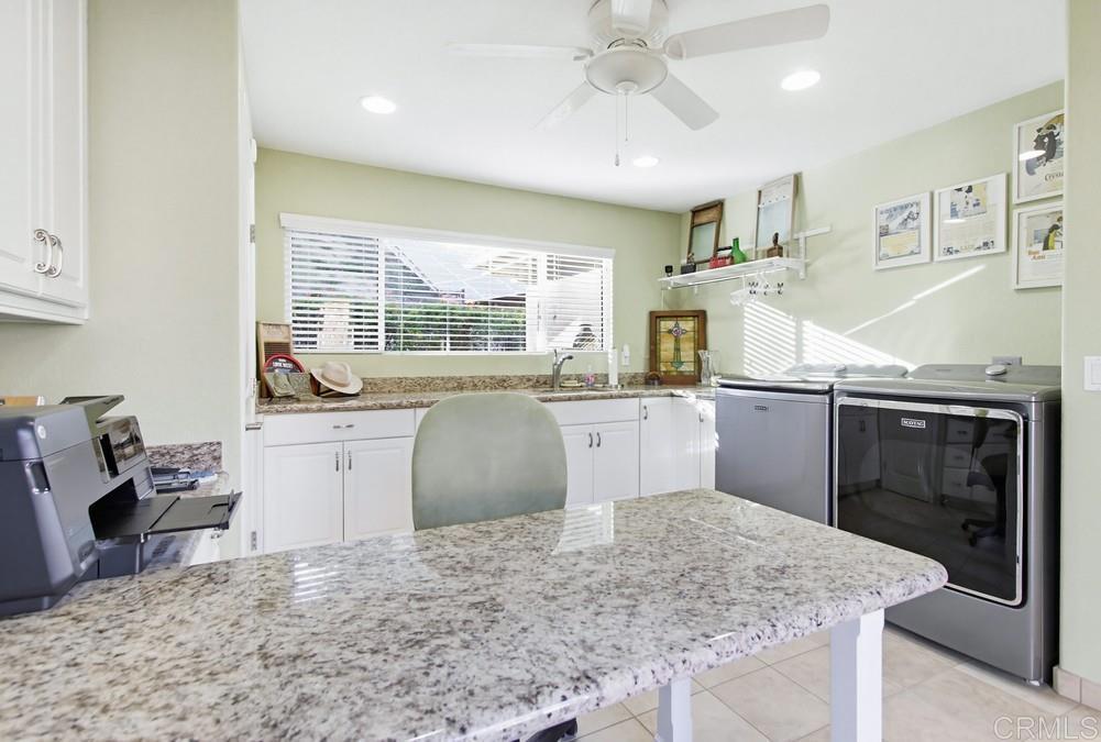 3930 Via Palo Verde Lago Alpine, CA 91901 - Photo 50 of 75 a kitchen with stainless steel appliances granite countertop a sink stove and refrigerator