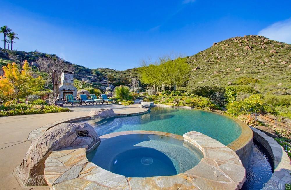 3930 Via Palo Verde Lago Alpine, CA 91901 - Photo 58 of 75 a view of a swimming pool with a lawn chairs