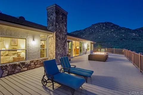a view of swimming pool patio and mountain view in back