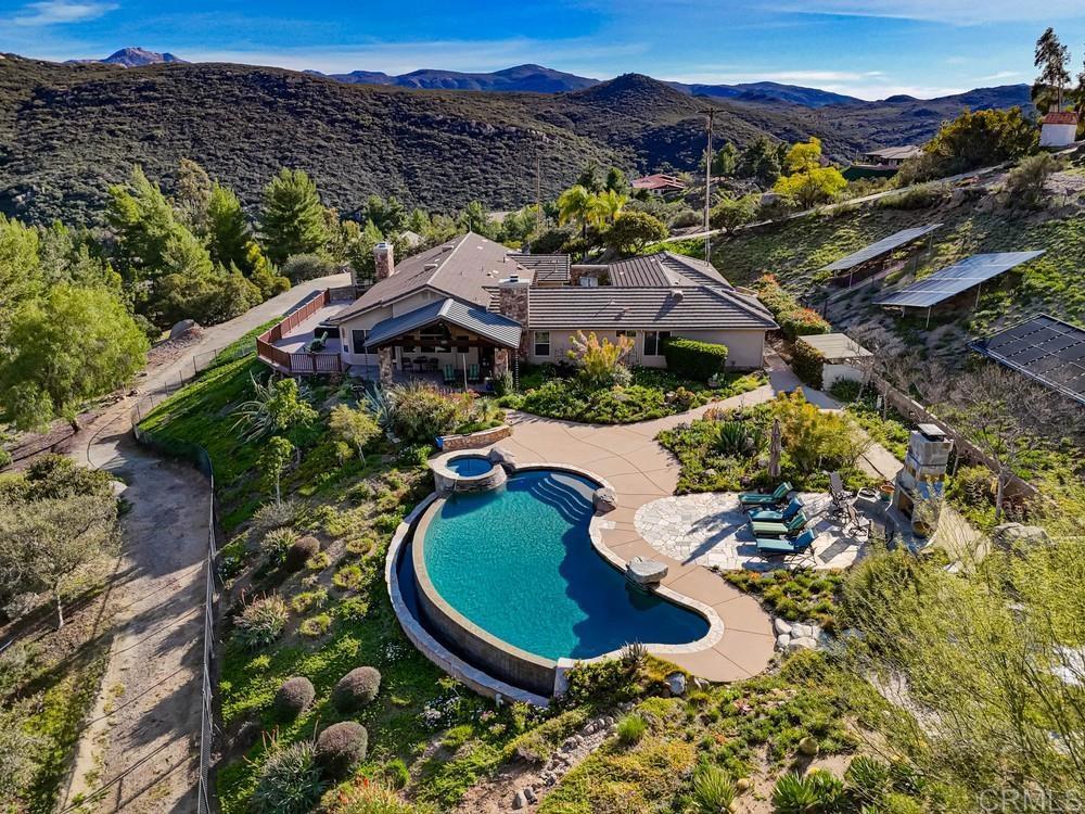 3930 Via Palo Verde Lago Alpine, CA 91901 - Photo 69 of 75 a view of a house with a swimming pool and a yard