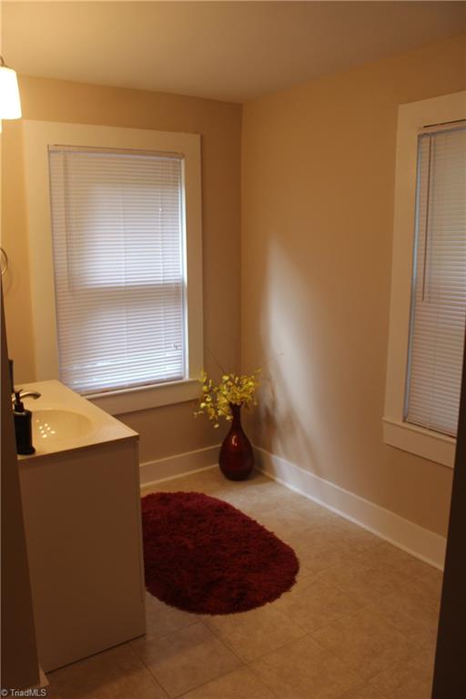 5650 Reynolda Road Winston-Salem, NC 27106 - Photo 8 of 21 Spacious master bath with all new fixtures including tub, toilet sink and tile!