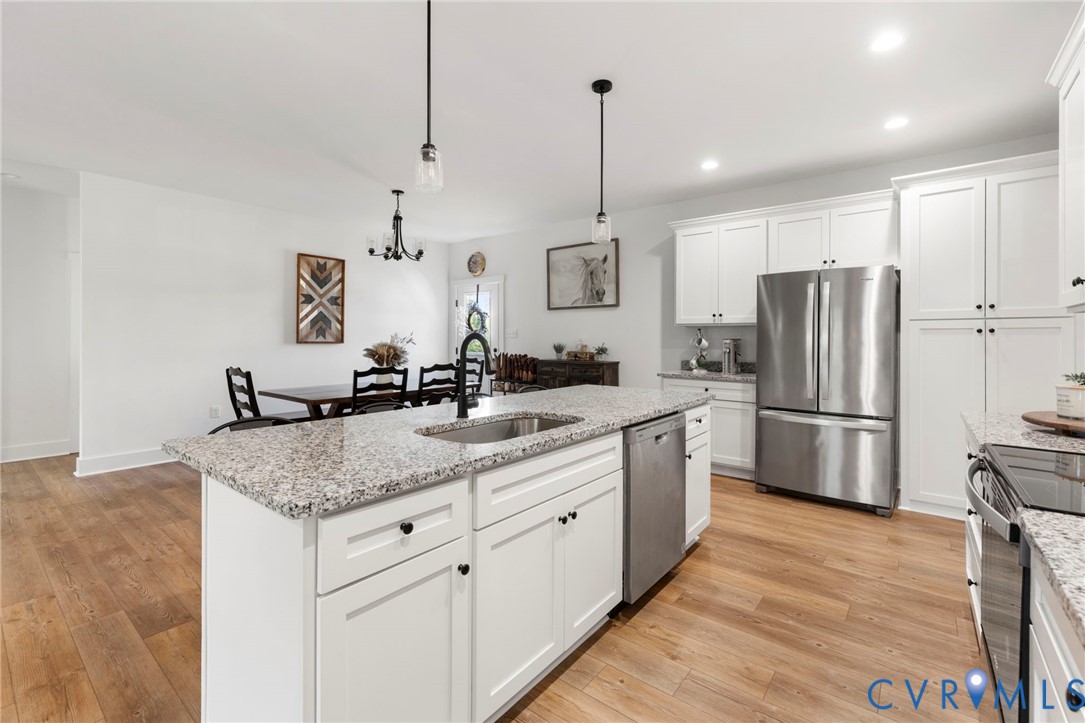 77 Jenkins Church Road Cumberland, VA 23040 - Photo 11 of 46 a kitchen with stainless steel appliances granite countertop a sink refrigerator and cabinets