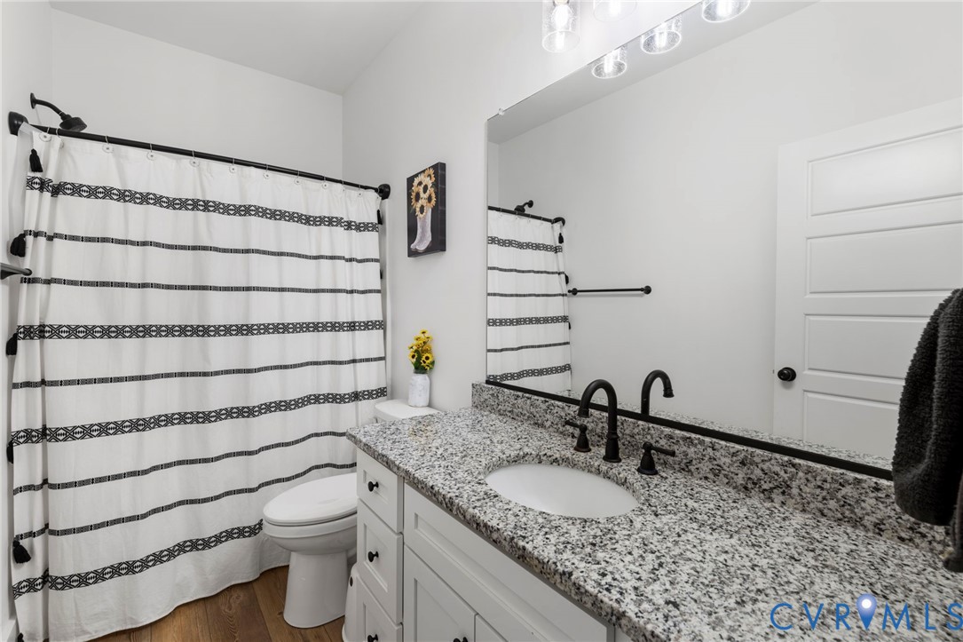 77 Jenkins Church Road Cumberland, VA 23040 - Photo 19 of 46 a bathroom with a granite countertop sink toilet and shower