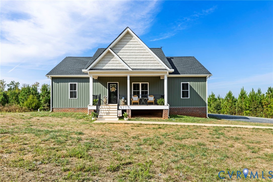 77 Jenkins Church Road Cumberland, VA 23040 - Photo 2 of 46 a front view of a house with swimming pool and porch with furniture