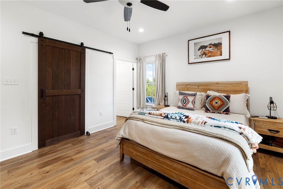 77 Jenkins Church Road Cumberland, VA 23040 - Photo 23 of 46 a bedroom with a bed and wooden floor