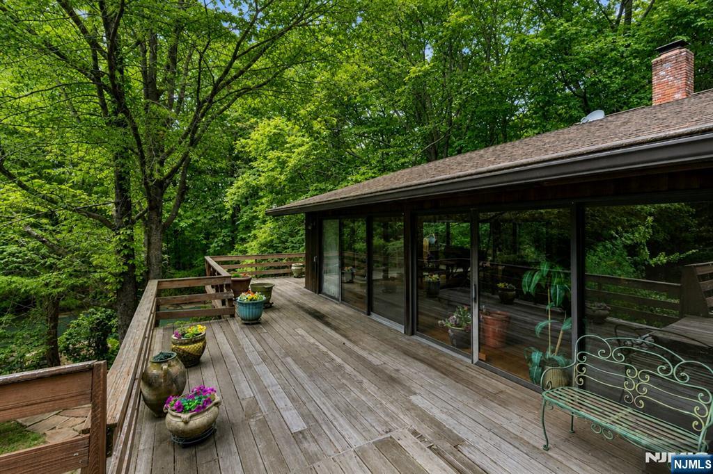 34 Cambridge Way Alpine, NJ 07620 - Photo 36 of 48 a view of backyard with green space and balcony