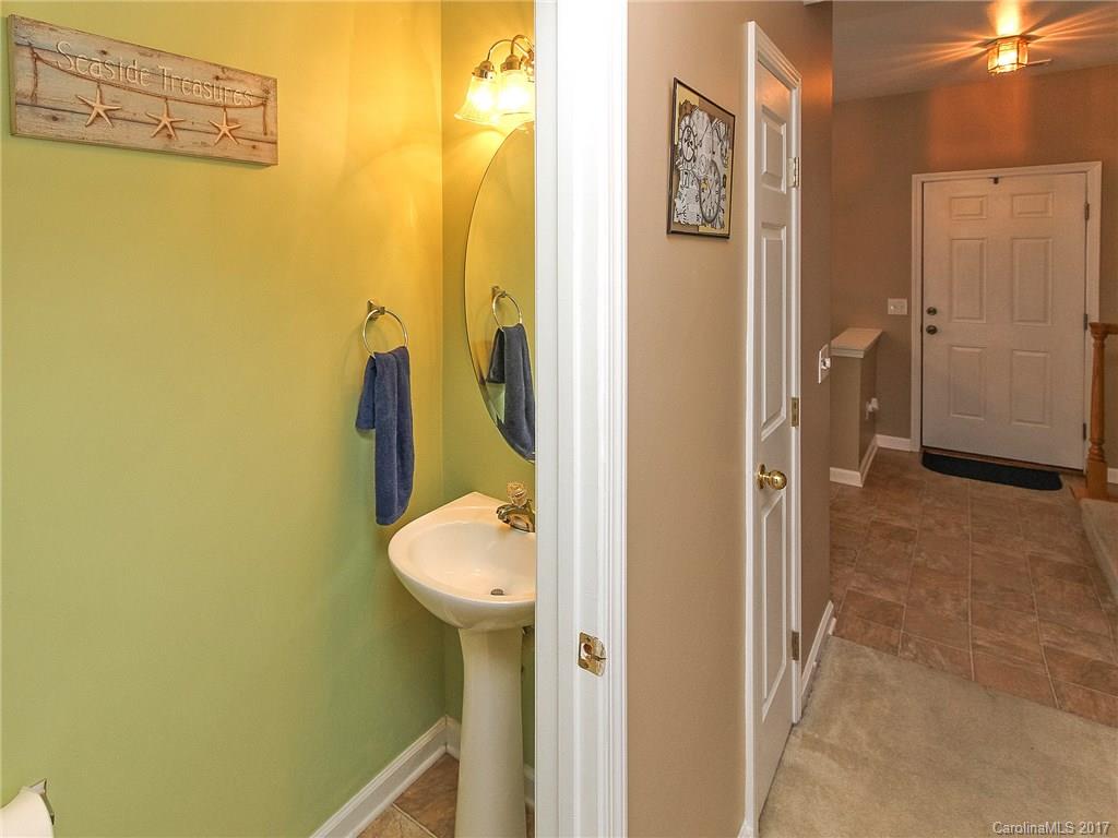 853 Dillard Road, Unit 103 Rock Hill, SC 29730 - Photo 13 of 18 a bathroom with a sink and toilet
