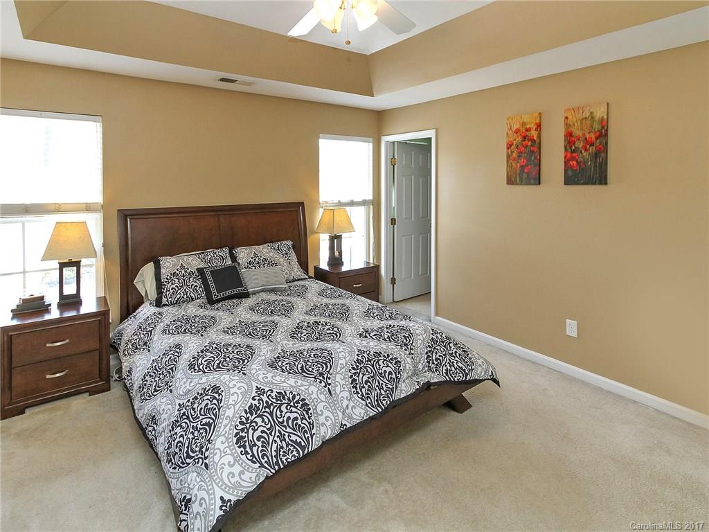853 Dillard Road, Unit 103 Rock Hill, SC 29730 - Photo 14 of 18 a bedroom with a bed and a window