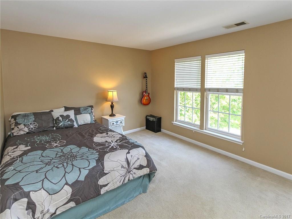 853 Dillard Road, Unit 103 Rock Hill, SC 29730 - Photo 16 of 18 a bedroom with a large bed and a window