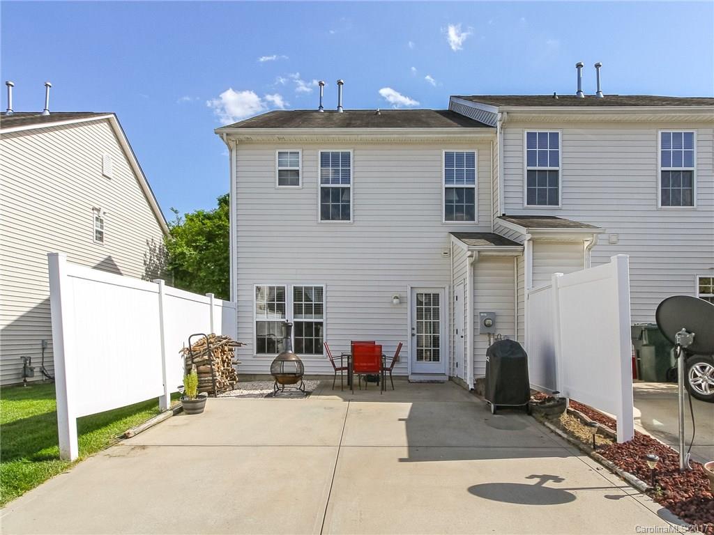 853 Dillard Road, Unit 103 Rock Hill, SC 29730 - Photo 18 of 18 a view of a patio with table and chairs a barbeque