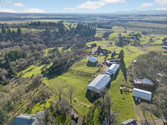 a view of a swimming pool with a yard and mountain view