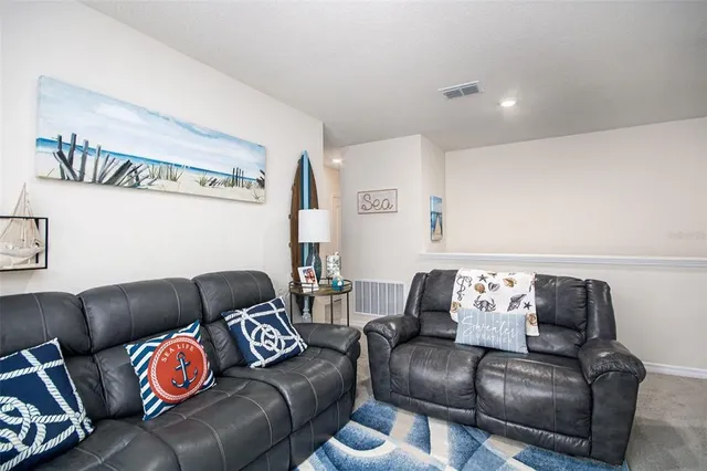 a living room with furniture and a couch