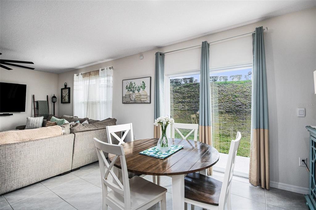 3027 Beau Loop Tavares, FL 32778 - Photo 8 of 30 a view of a dining room with furniture window and outside view