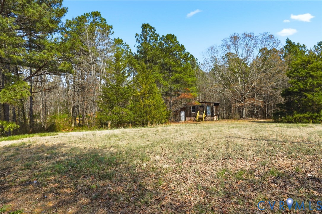 3490 Willow Brook Road Bumpass, VA 23024 - Photo 27 of 29 a view of outdoor space with trees all around