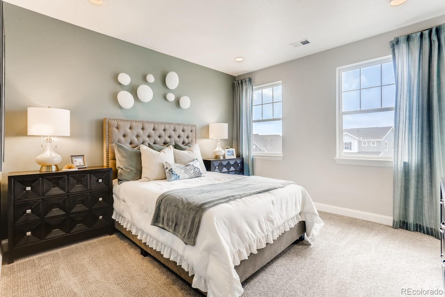3008 Blithe Point Castle Rock, CO 80108 - Photo 18 of 29 a bedroom with a bed and a window