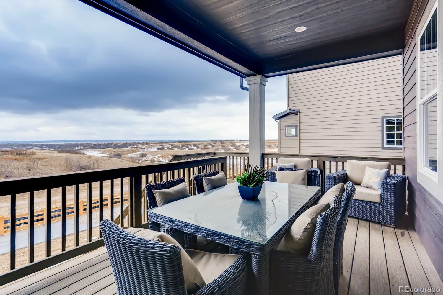 3008 Blithe Point Castle Rock, CO 80108 - Photo 26 of 29 a view of a balcony with a table and chairs