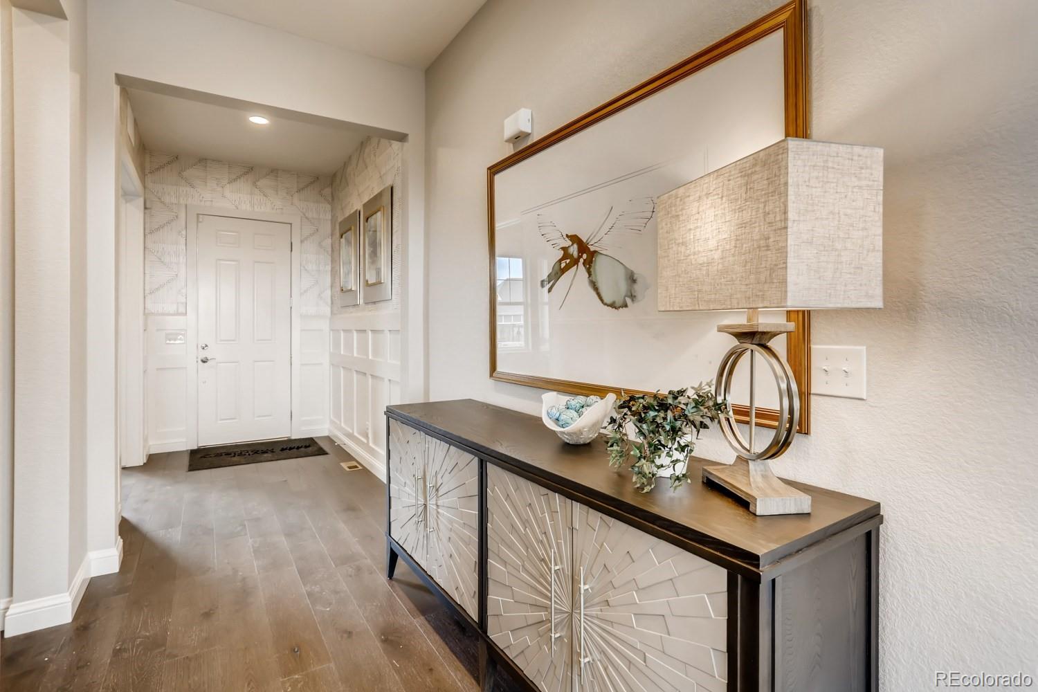 3008 Blithe Point Castle Rock, CO 80108 - Photo 3 of 29 a bathroom with a sink and a mirror