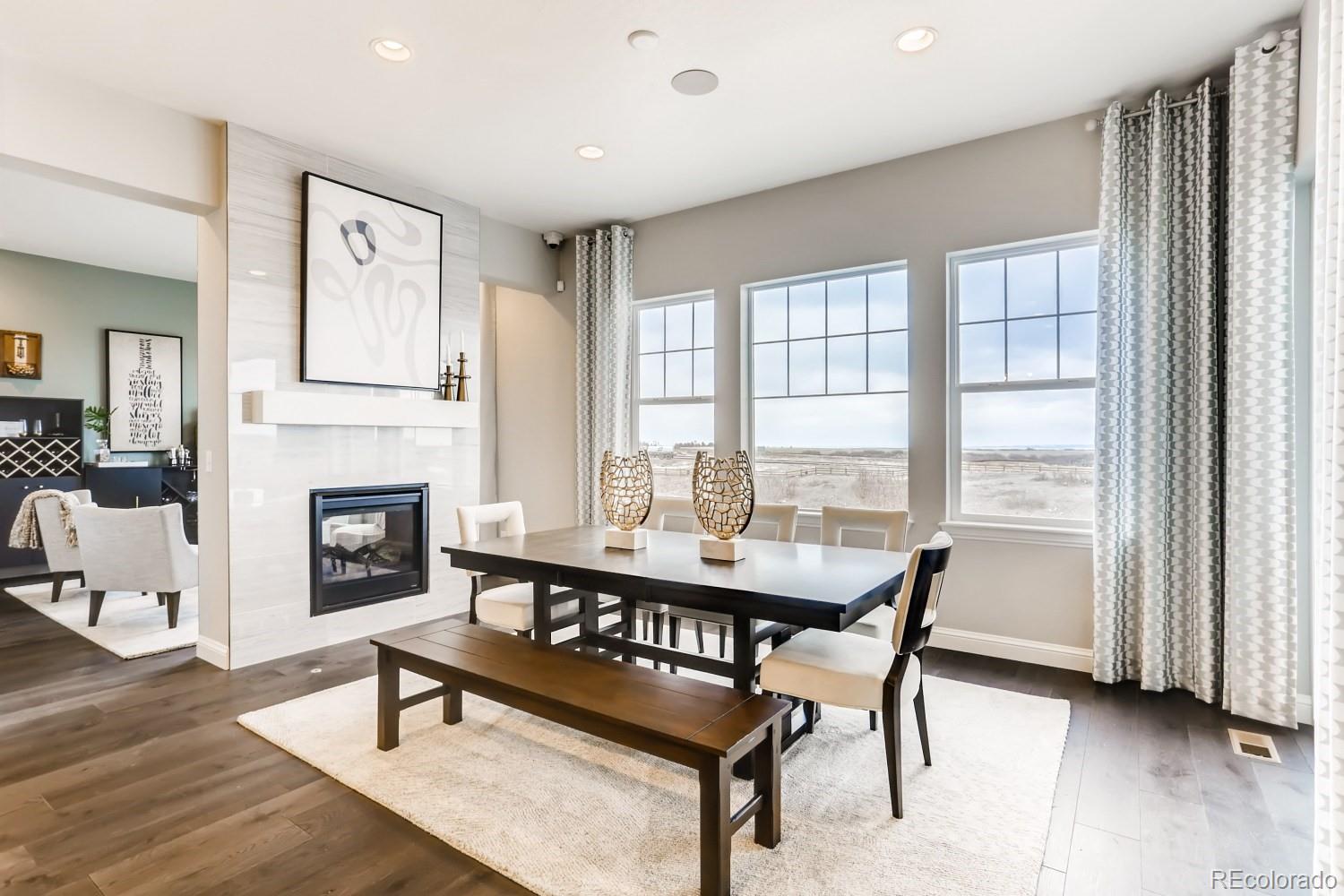 3008 Blithe Point Castle Rock, CO 80108 - Photo 7 of 29 a dining room with furniture window and wooden floor