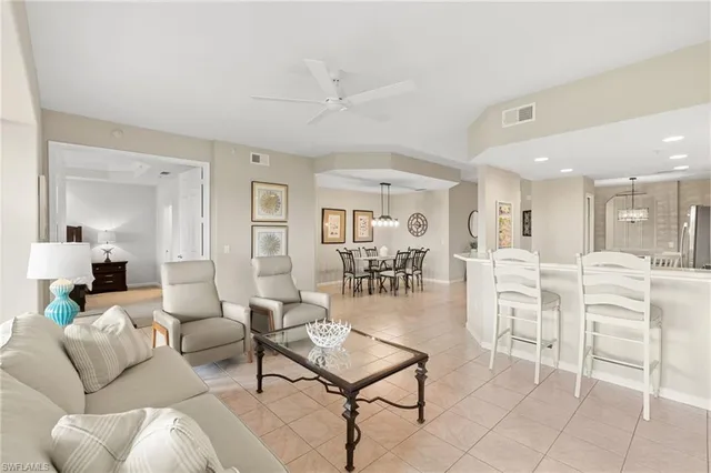 a living room with furniture white walls and white walls