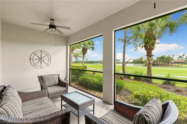 a living room with large windows