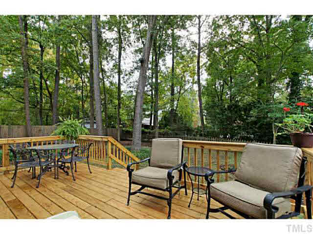 2008 Port Royal Road Raleigh, NC 27609 - Photo 22 of 25 Huge Deck for entertaining. Notice the back yard has nice trees but has also been cut back to allow a lot of natural light.