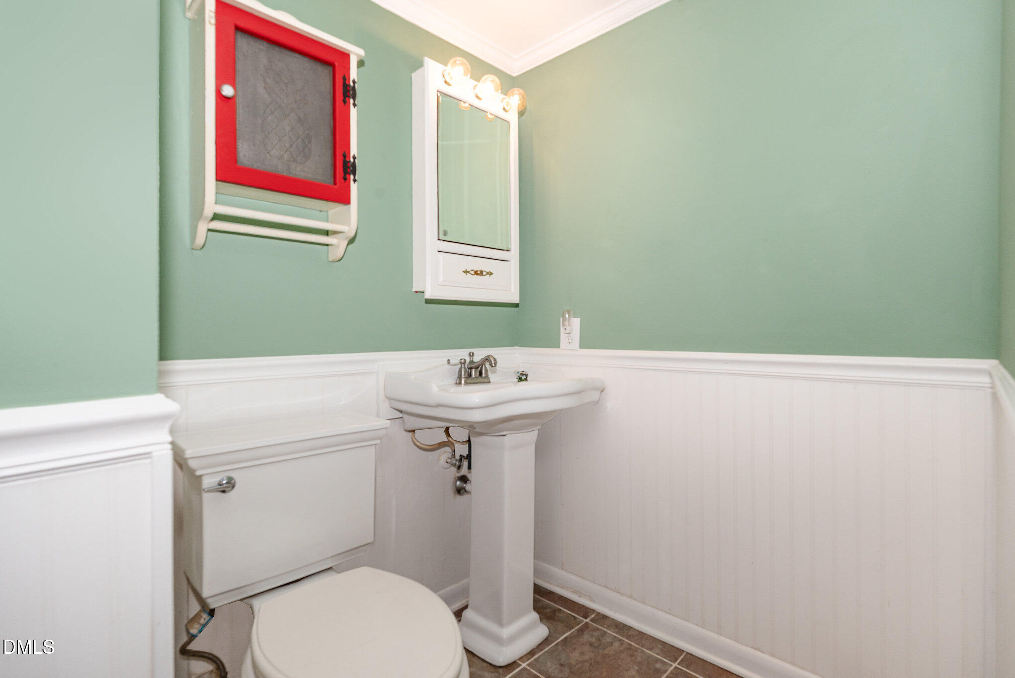 5920 Farm Gate Road Raleigh, NC 27606 - Photo 11 of 16 a bathroom with a sink and mirror