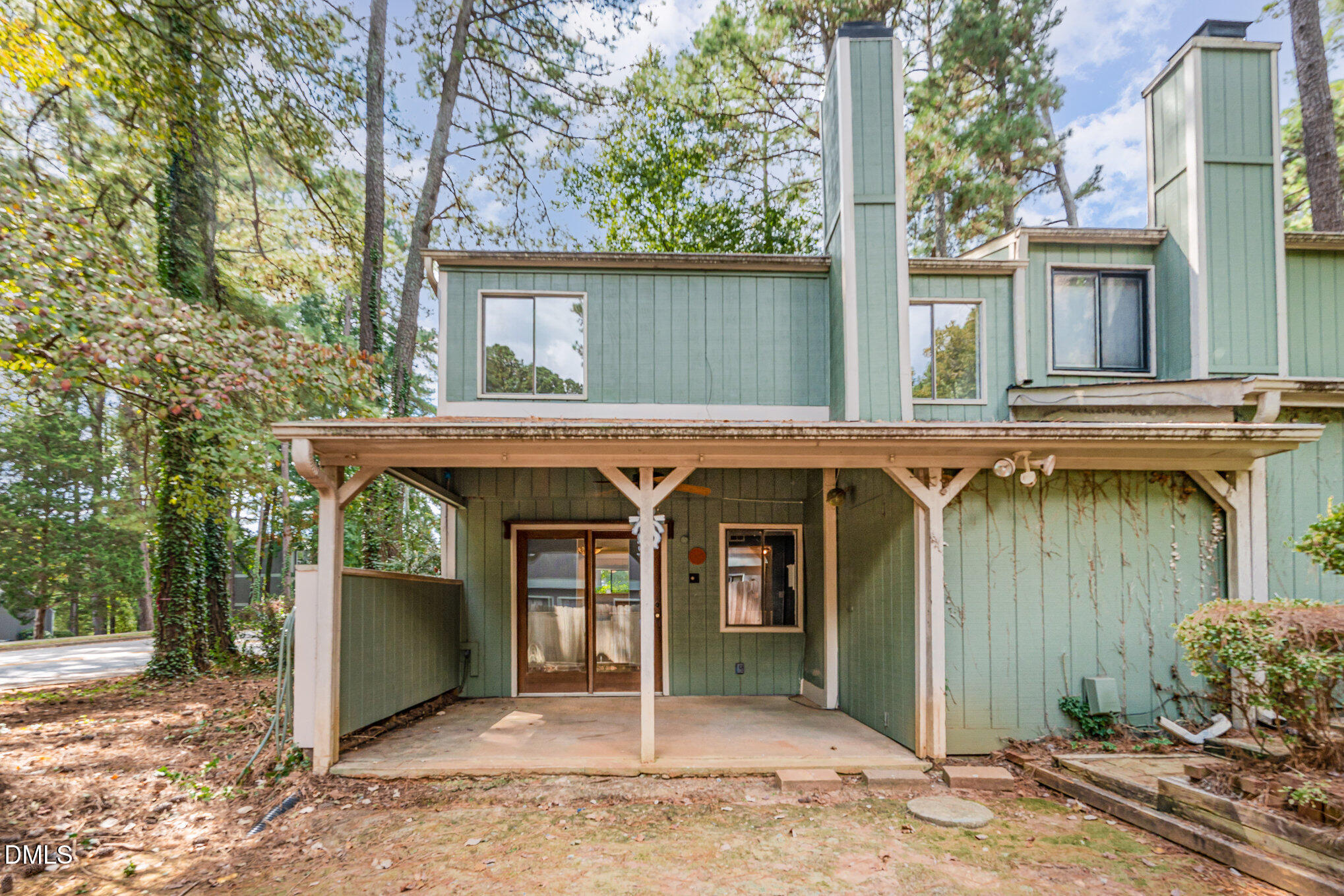 5920 Farm Gate Road Raleigh, NC 27606 - Photo 14 of 16 a view of a house with a porch and furniture