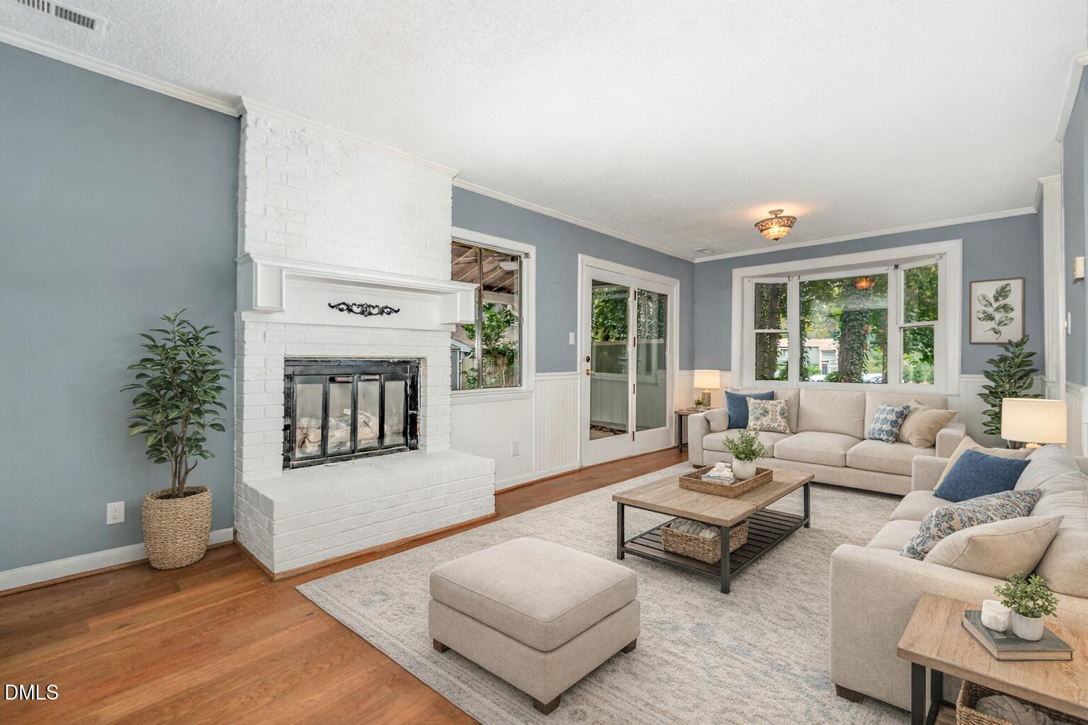 5920 Farm Gate Road Raleigh, NC 27606 - Photo 3 of 16 a living room with furniture and a potted plant